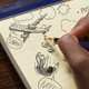 Image for article titled Bored Kamala Harris Doodles Cartoon Of Refugee Being Thrown Out Of Airplane In Margin Of Notes